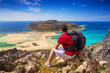 Man with backpack watching beautiful Balos beach on Crete, Greece