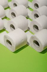 Toilet paper concept on green background. Hygiene and health. Concept photo.