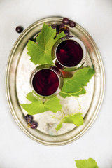 Wall Mural - Wine and grapes over grey marble background