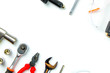 © Goodvibes Photo - Top view of Working tools,wrench,socket wrench,hammer,screwdriver,plier,electric drill,tape measure,machinist square and safety glasses on white background.flat lay design for construction concept