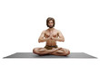 People, yoga, active lifestyle, health, wellness and meditation concept. Relaxed peaceful young bearded guy practicing yoga indoors, sitting cross legged on mat, meditating with eyes closed