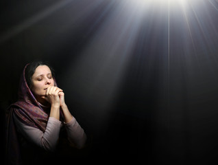 Wall Mural - Praying woman in scarf