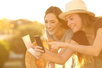 Sticker - Tourists checking information on line at sunset