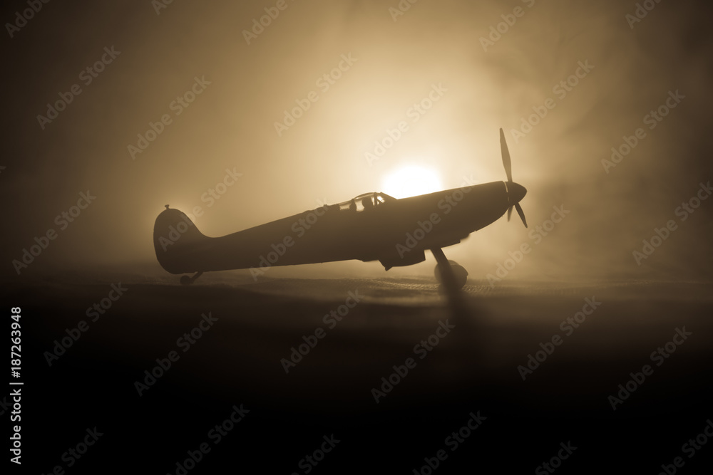 British jet-propelled model plane in possession. Dark orange fire background. War scene. - obrazy, fototapety, plakaty 