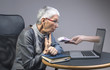 Senior old lady being lured into an online scam that promises easy money, money fraud concept