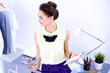 © lenets_tan - Modern young fashion designer working at studio.