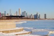 Winds and bitter cold with wind chill factors exceeding minus 20 degrees created vapor both above the forming ice in Lake Michgan in front of the Chicago skyline.