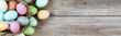 Easter eggs on rustic wooden background for holiday concept 