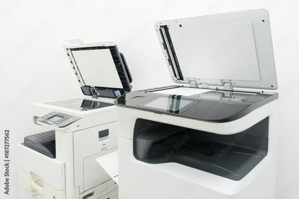 photocopier is a machine that makes paper copies of documents and other ...