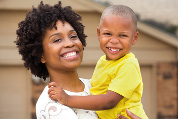 young african american mother playing and her son.