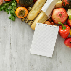 Poster - Top view set raw food notebook wooden background. Healthy food