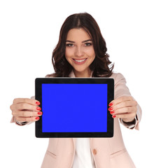 Wall Mural - smiling young business woman showing blank screen of a tablet