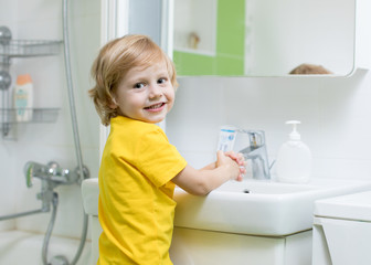 Wall Mural - Little child boy washing hands