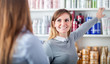 © leszekglasner - Customer woman choosing cosmetics with assistant in beauty store