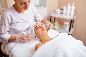 Wall Mural - woman on facial skincare procedure. hardware cosmetology.