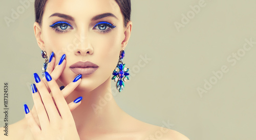 Beautiful model girl with blue manicure on nails Poster Mural XXL