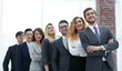 © ASDF - successful business team standing in a row.