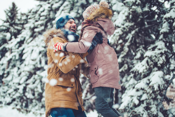 Wall Mural - Dad with daughter outdoor in winter