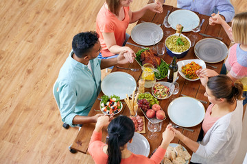 Poster - group of people at table praying before meal