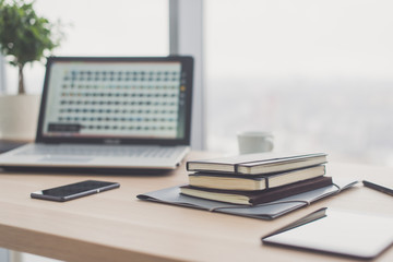 Documents on office table with pen and digital tablet as work space business concept.