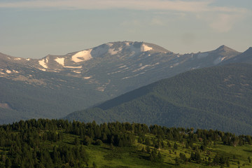 Mountain landscape. At a distance you can see the snow on top of the mountain.