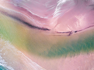 Aerial View looking down on a Welsh Beach in the UK. Looking straight down at the great expanse of a textured sandy beach, Taken 400 feet in the air by a drone.