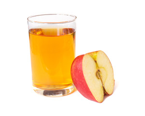 Apple juice in a glass cup and fresh cut apple isolated on a white background