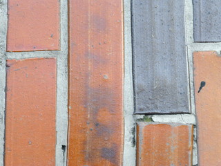 Dirty old tiles of two different colors 