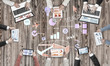 © adam121 - Top view of businesspeople sitting at table and using gadgets