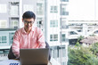 © Thomas - Portrait of happy business man with laptop celebrating success.