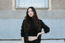 Portrait Of Young Pretty Asian Girl In Black Bomber Jacket
