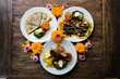 © Nabi Tang/Stocksy - Overhead view of Mexican food decorated with flowers on table
