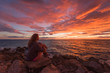 © RG&B Images/Stocksy - Woman admiring the seascape during sunrise