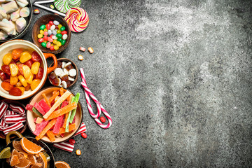 Poster - Multicolored candy, jelly and marshmallows in a bowl.