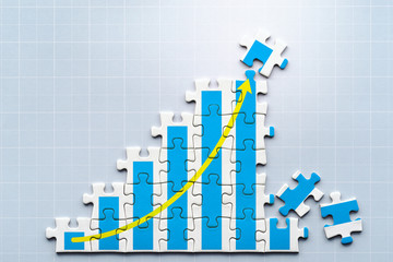Poster - Creation of growth. Growth chart drawn on puzzle. Working on puzzle. Reflection squared background.