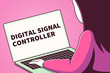 Woman looking at a laptop screen with the words digital signal controller