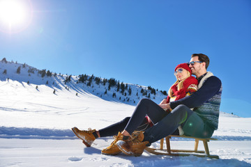 romantic winter scene, happy young couple having fun on fresh show on winter vacatio, mountain nature landscape