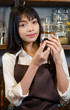 © Vuttigrai - Girl barista bartender waiter in uniform making coffee at the bar