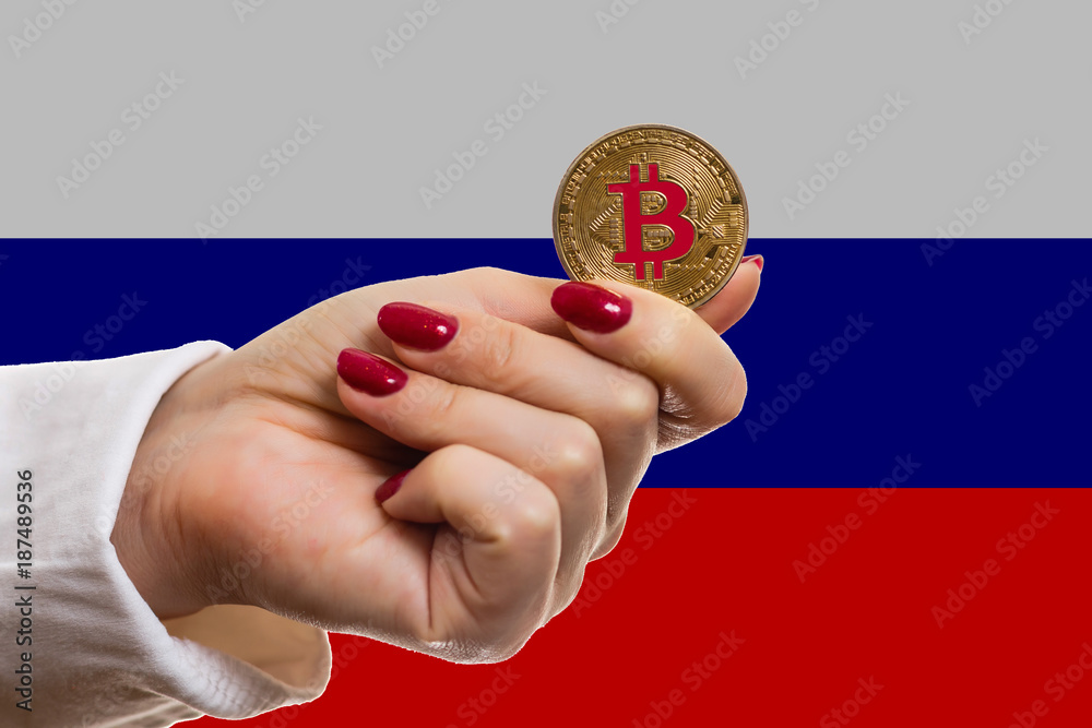 Female hand holds bitcoin isolate bitcoins and new virtual money concept