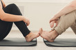 © Prostock-studio - Young couple practicing yoga together in studio