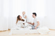 © Rithor - Happy parents and their child at home