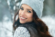 beautiful smiling young woman in wintertime outdoor. Winter concept