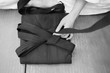 The training participant adds the underside of the hakama aikido clothing