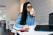 © mnelen.com - businesswoman in the office drinking coffee and eating a sandwich