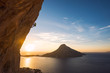 © RG&B Images/Stocksy - Man rock climbing with beautiful seascape in the background