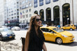 © HEX./Stocksy - Young Female Student Walking in New York City US