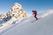 © RG&B Images/Stocksy - Side view of man skiing downhill steep slope