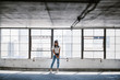 © Aaron Thomas/Stocksy - Playful Girl in Parking Garage