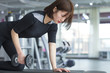 © Bo Bo/Stocksy - One young asian woman work out in the gym