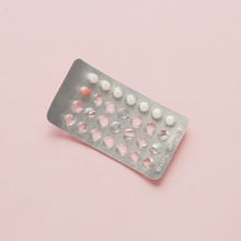 Contraceptive Pills Blister Over Pink Background